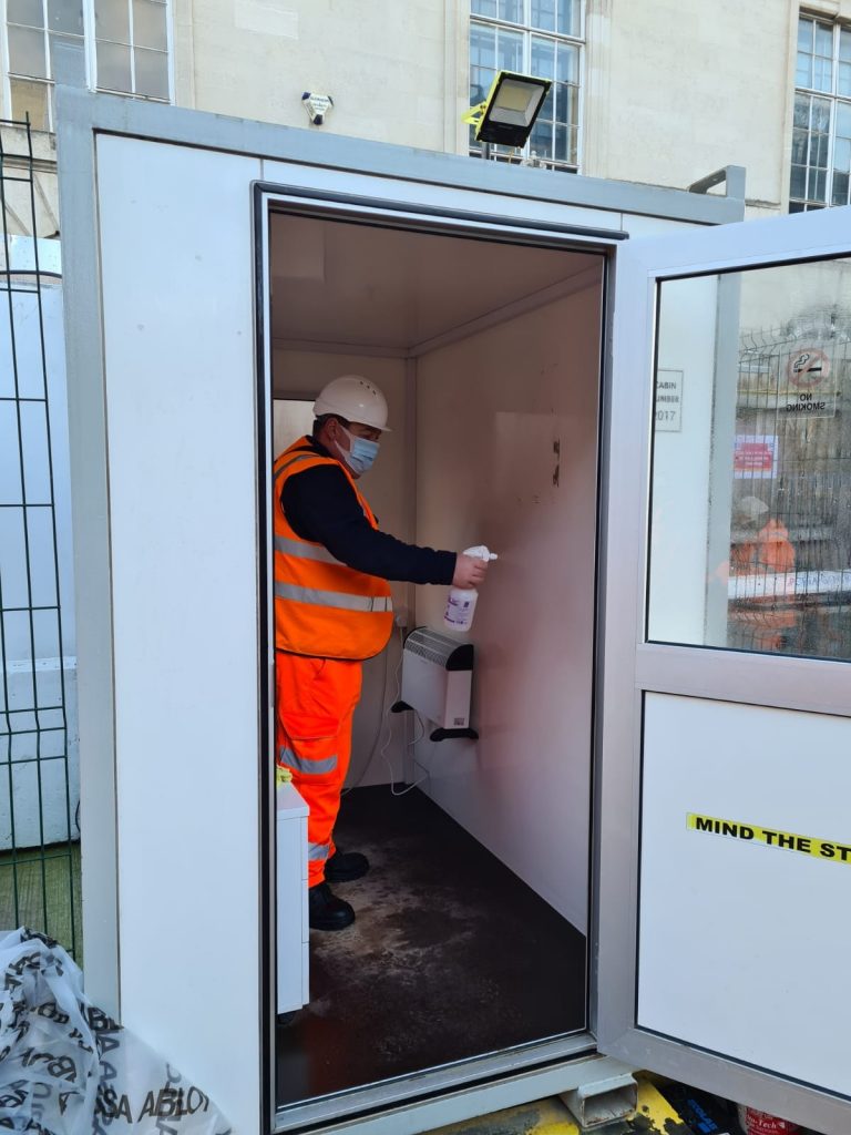 Photo of one of our staff performing a cleaning service in an outside facility